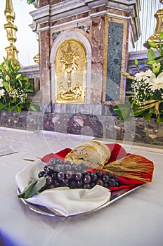 Bread and grapes on the altar to become the body and blood of jesus christ