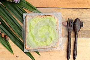 Bread with green custard and fresh milk.