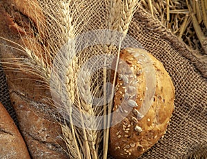 Bread and heat ears on sackcloth in the summer haystack