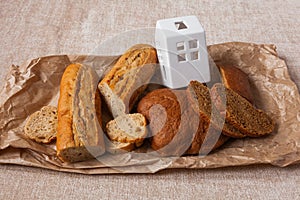 Bread home house ciabatta slices food background brown paper canvas wheat bran graine yeast leaven