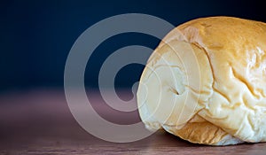 Bread Isolated on a wooden table and blackboard on background.
