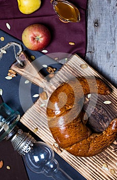 Bread and jam on the scratched wooden cutting board