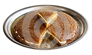 Bread kadayif isolated on a white background. Sliced bread kadayif in a tray