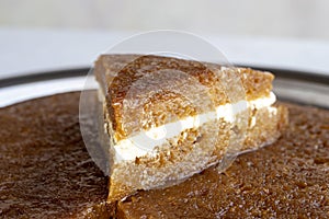 Bread kadayif on a white background. Sliced bread kadayif in a tray