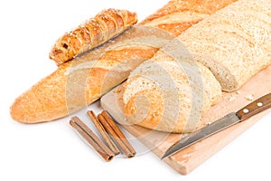 Bread, knife isolated over white