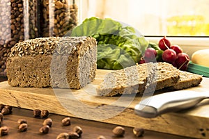 Bread knife vegetables on table