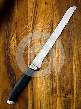 Bread Knife on Wooden Board