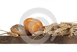 Bread loaf and buns on a shelf