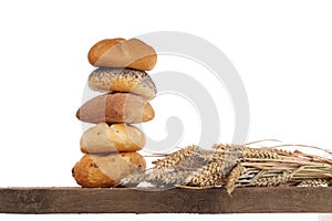 Bread loaf and buns on a shelf