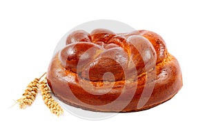 Bread loaf and wheat ear on a white background.