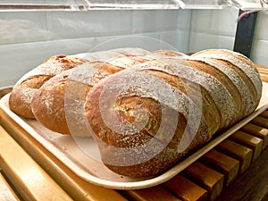 Bread Loafs in tray. Scoring Bread.