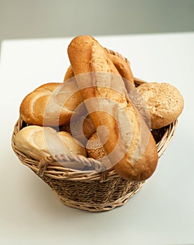 Bread loaves and baguettes in a wicker basket