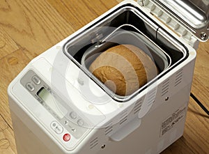 Bread machine making fresh bread at home.