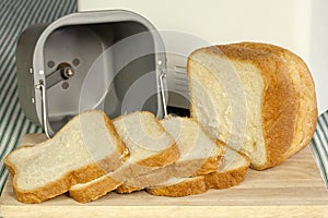 Bread machine making fresh bread at home.
