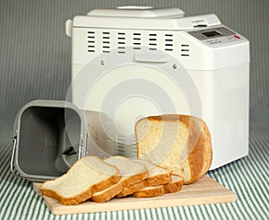 Bread machine making fresh bread at home.