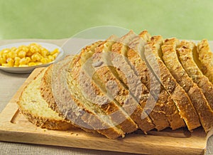 Bread made from corn. Whole grains are in a bowl