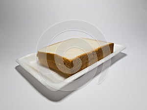 Bread made from flour and other ingredients in a white container