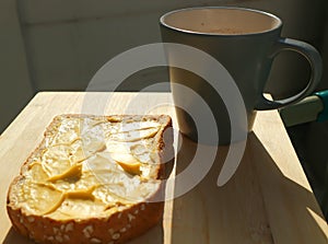 Bread with magarine topping and hot drink