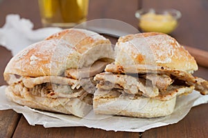 Bread with meat on brown wooden background photo