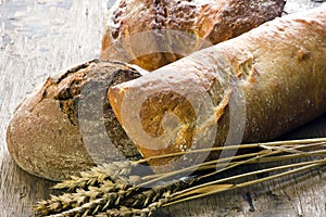 Bread on old wooden background