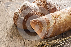 Bread on old wooden background