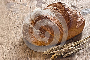 Bread on old wooden background