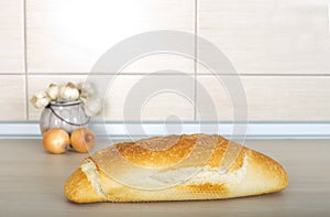 Bread onion and garlic on the countertop