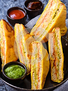 Bread pakora served with tomato sauce