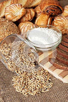 Bread, pastries, meal and pot with grains