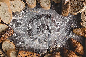 Bread and pastry flour on a wooden table