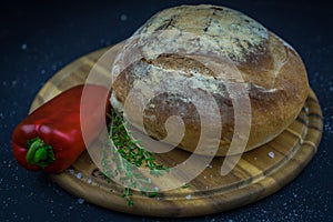 Bread, pepper and thyme presented on a tray