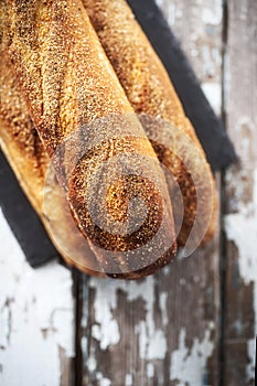 Bread with polenta grains on a wooden table