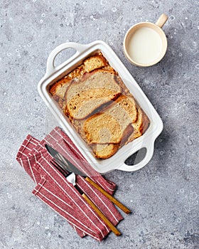 Bread pudding breakfast casserole made from wheat bread, eggs, milk and grated apples