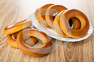 Bread rings baranka in dish, bread rings on wooden table photo