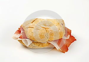 Bread roll (friselle) with slices of Schwarzwald ham