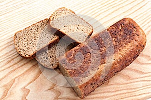 Bread rye on a wooden background. Top view