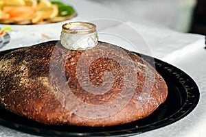 Bread-and-salt welcome. A traditional ritual of offering bread and salt to a welcome guest