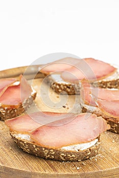 Bread sandwich with cheese and ham on the top