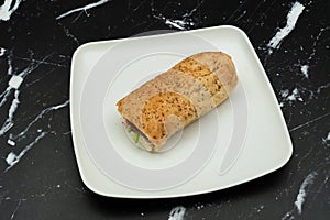 Bread sandwich with square and white plate