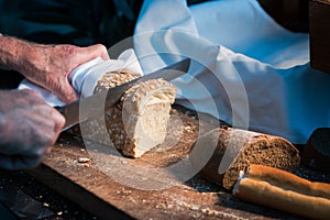 Bread separate by knife and hand