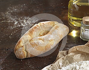 Bread single on a rustic wooden countertop , photo