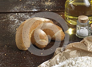 Bread single on a rustic wooden countertop , photo