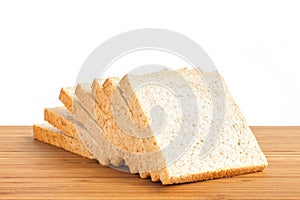 Bread slice on wooden table isolated in white background