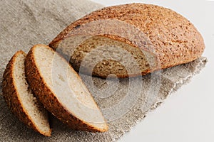 bread, sliced in sackcloth on white background