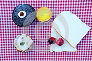 Bread slices cupcake dessert on red tablecloth