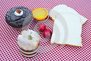 Bread slices cupcake dessert on red tablecloth