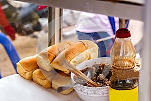 Bread is sold in a morning market in Laos