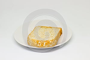 Bread with spread jam on the wooden dish