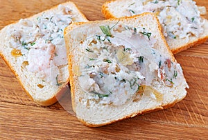 Bread spread with lard with spices, fresh dill and fried onions. Home food.