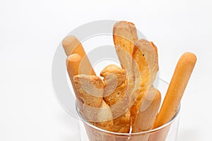 Bread stick on cup isolated on white